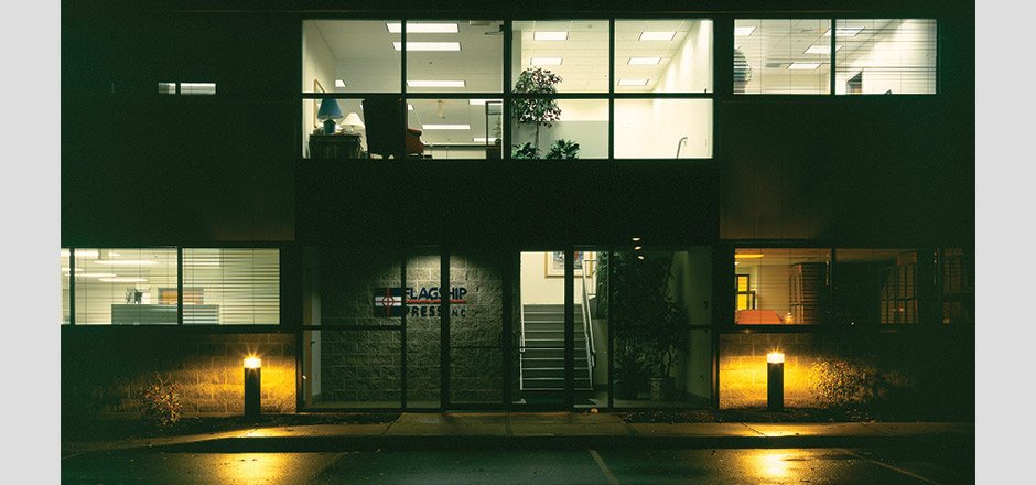 Flagship Press building exterior at night