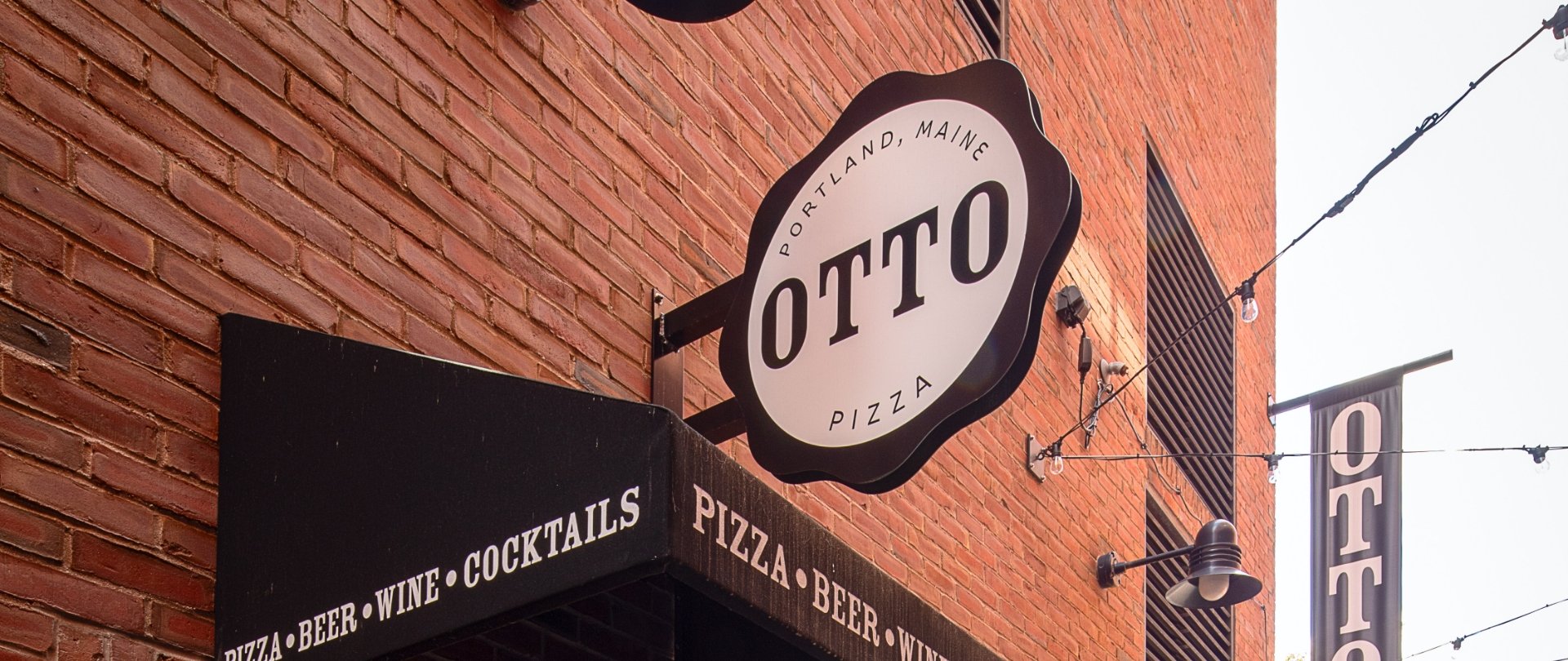 Otto Pizza exterior entry sign